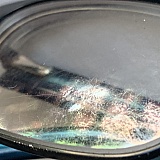 Coating came off with optical cleaning solution and the cleaning cloth provided by America’s Best.