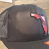 Damaged from excessive and prolonged heat when applying the logo.