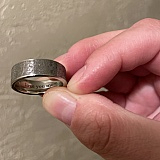 Stainless steel ring with custom inscription on the inside.