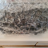 The amp came with one layer of bubble wrap taped around the amp housing.