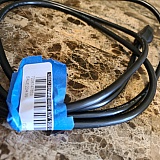 The power cord had been used and had a price tag sticker for a used microphone taped around it to keep it coiled up.